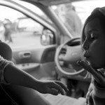 Inside their mother's car Eavan Kuenle blows a kiss to her sister Ella.